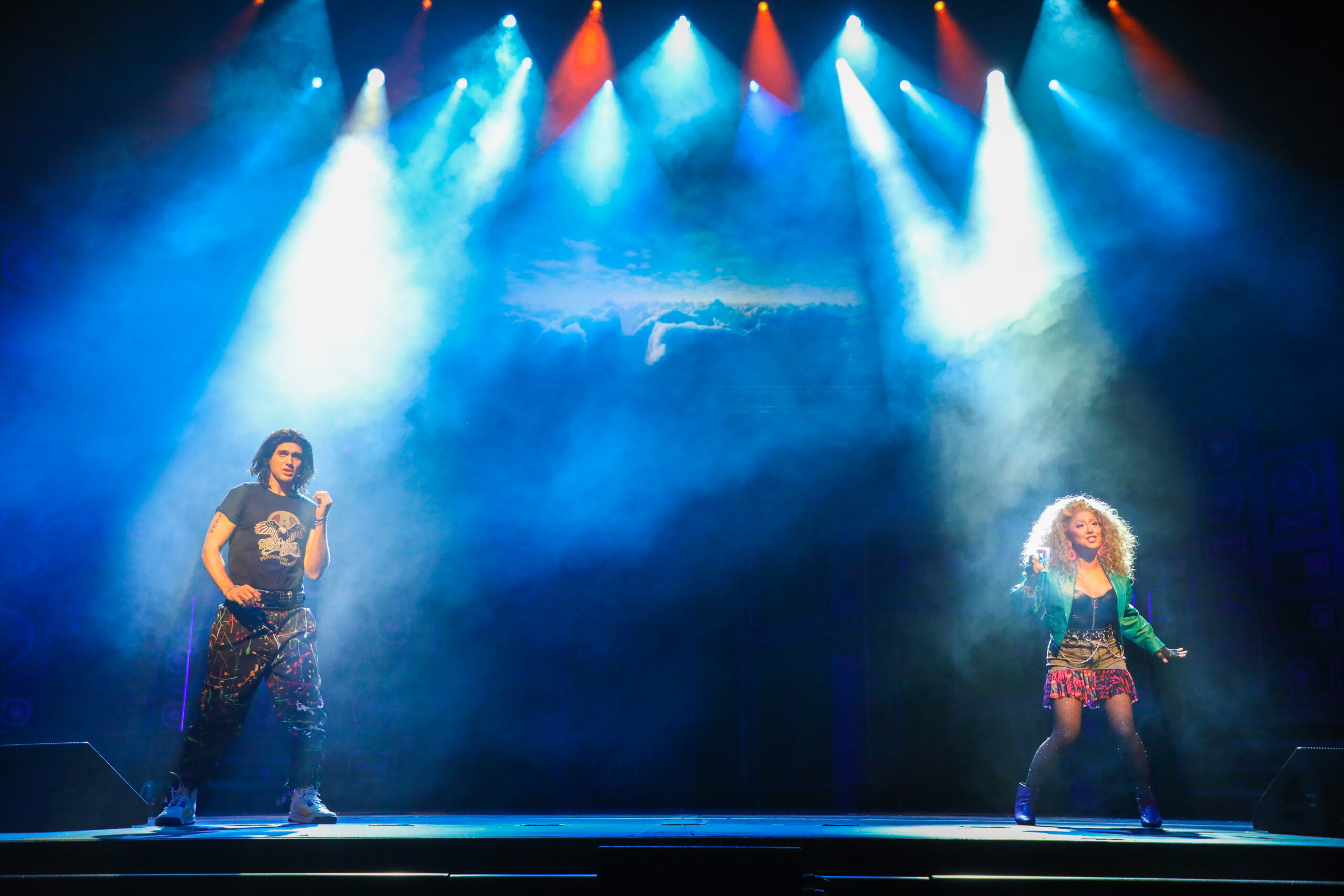 Justin Matthew Sargent as “Drew” and Diana Huey as “Sherrie” in the new TUTS production of Rock of Ages. Photo by Melissa Taylor.