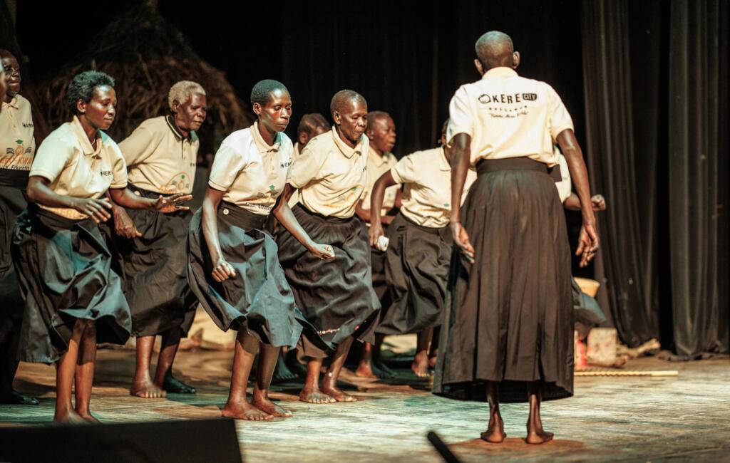 Okere City performers on stage in Uganda