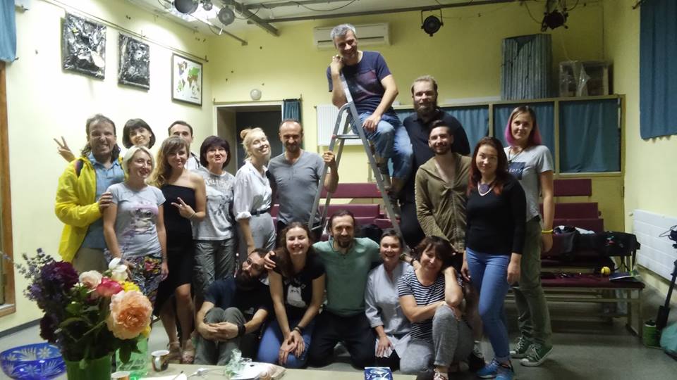 Dmytro Ternoviy (atop the ladder) with his theatre crew at Teatr na Zhukakh in Kharkiv.